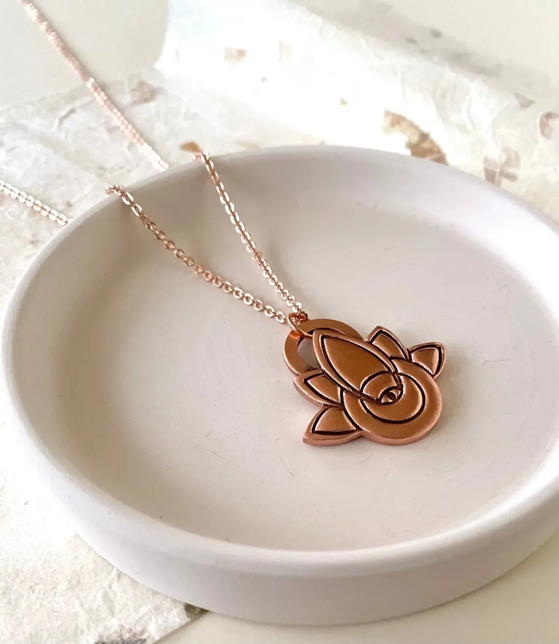 Lotus evil eye pendant, recycled copper with rose gold chain by Earth Fire Jewellery